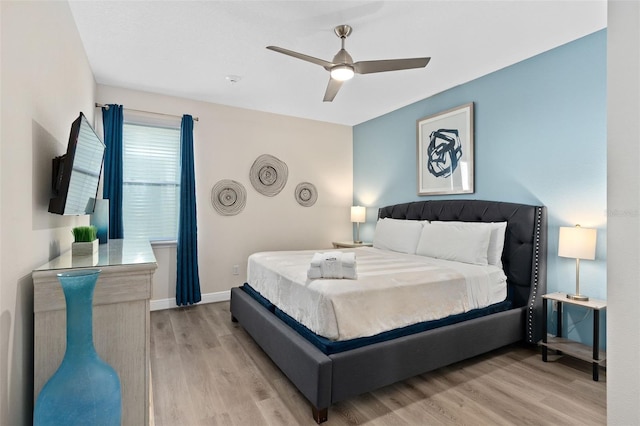 bedroom featuring light hardwood / wood-style floors and ceiling fan