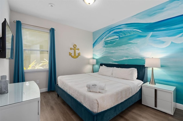 bedroom with dark wood-type flooring