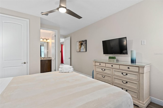 bedroom with connected bathroom and ceiling fan