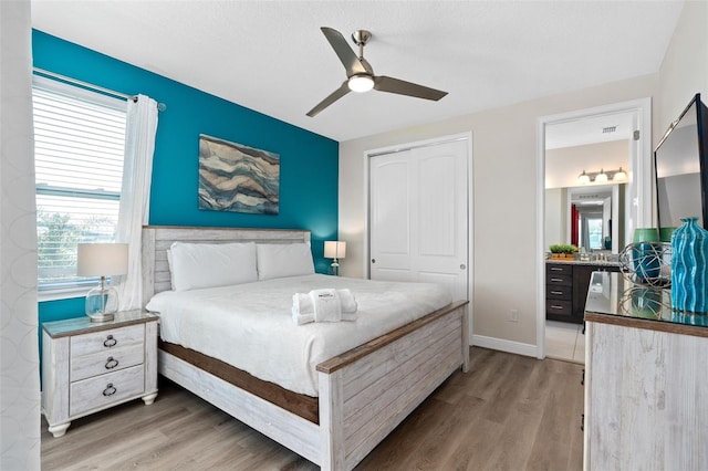 bedroom featuring hardwood / wood-style floors and ceiling fan