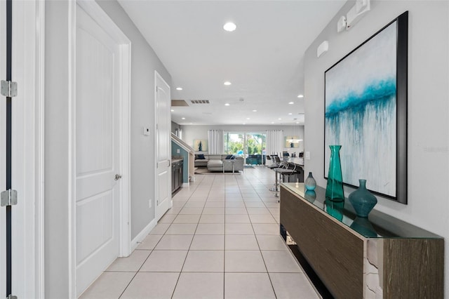 hallway featuring light tile patterned floors