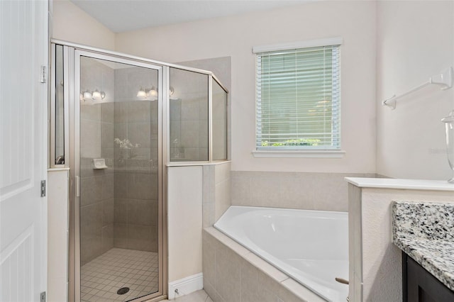 bathroom with separate shower and tub and vanity