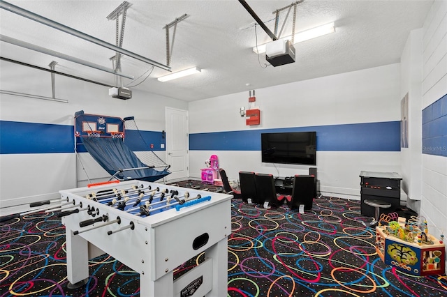 playroom featuring a textured ceiling