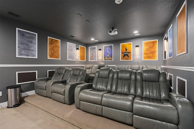 carpeted cinema with a textured ceiling