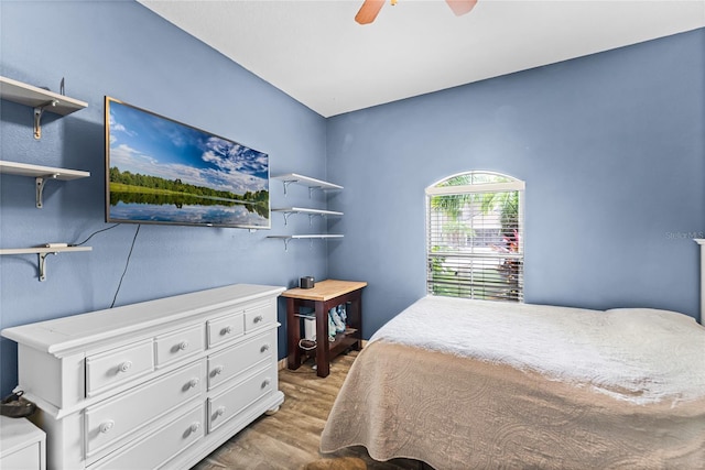 bedroom featuring a ceiling fan and wood finished floors