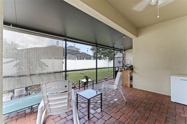 view of patio / terrace with fence and ceiling fan