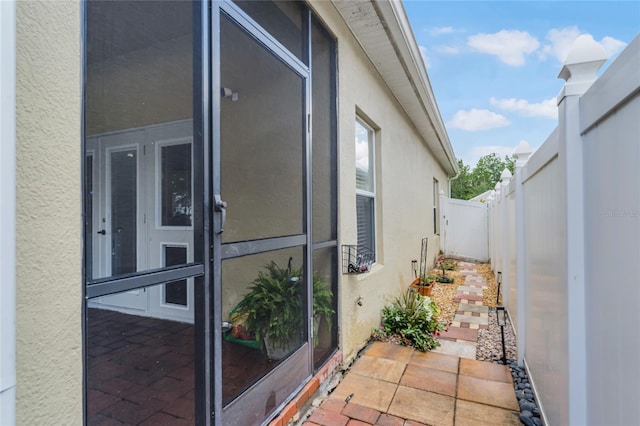 view of home's exterior featuring a fenced backyard, a patio, and stucco siding