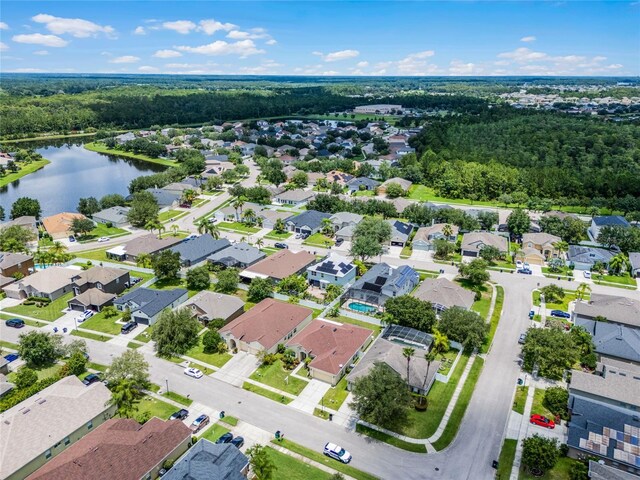 drone / aerial view with a residential view and a water view