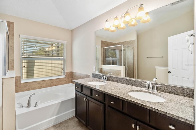 bathroom featuring tile patterned floors, vanity, and independent shower and bath