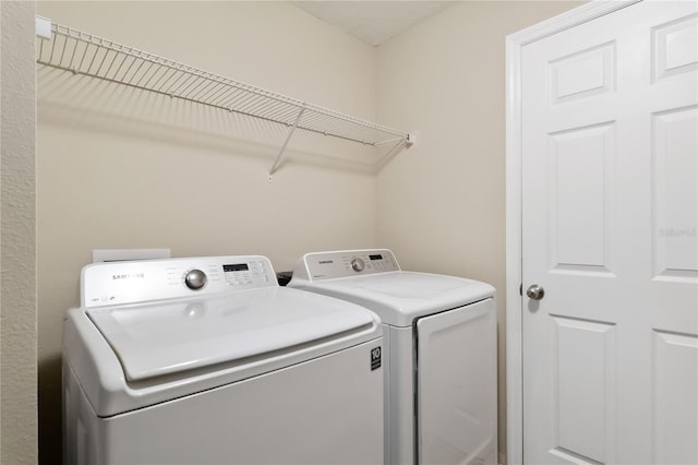 laundry area featuring washing machine and dryer