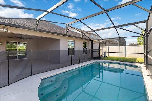 view of pool featuring a patio, ceiling fan, and a lanai