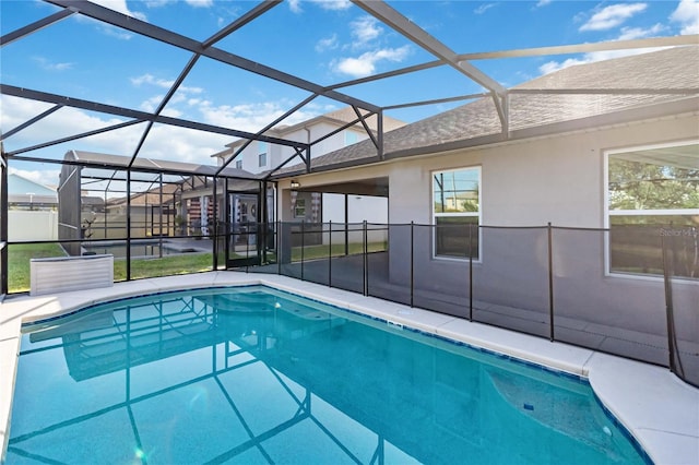 view of swimming pool with a lanai