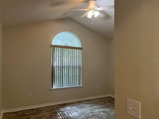 spare room with ceiling fan and vaulted ceiling