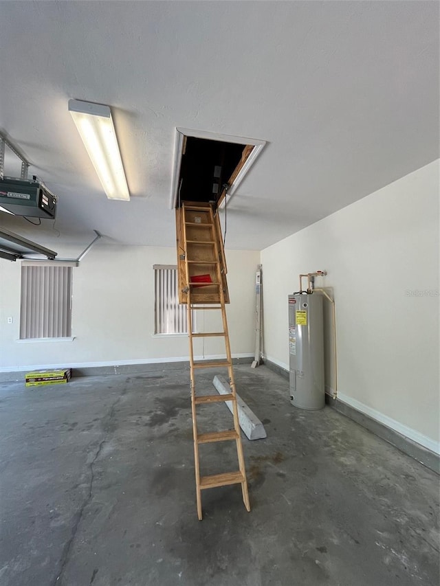 garage featuring water heater and a garage door opener