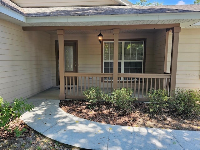 property entrance with covered porch