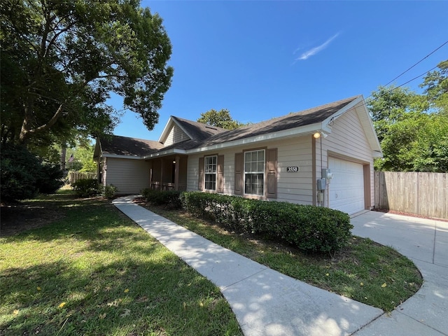 single story home with a garage and a front lawn