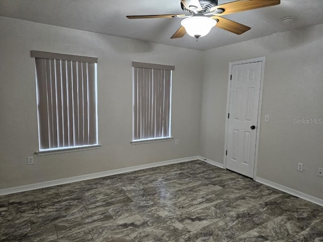 unfurnished room featuring ceiling fan