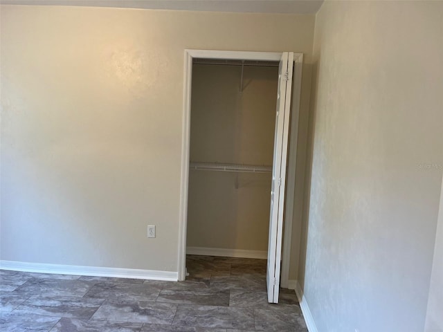 unfurnished bedroom with a closet