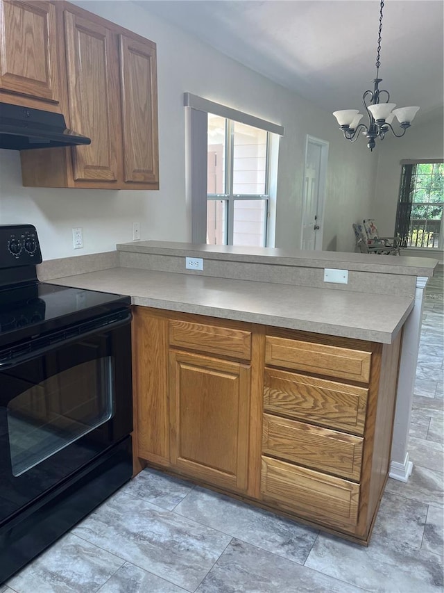 kitchen featuring kitchen peninsula, ventilation hood, hanging light fixtures, a chandelier, and black / electric stove