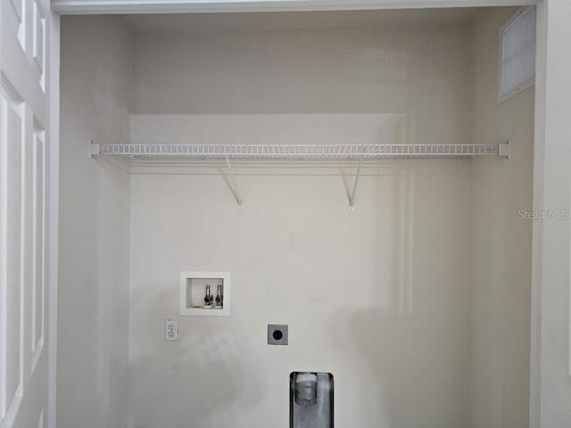 washroom with washer hookup and electric dryer hookup