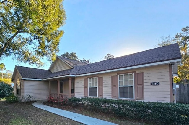 view of front facade with a shingled roof