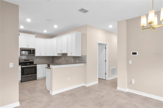 kitchen with appliances with stainless steel finishes, white cabinetry, tasteful backsplash, and light tile floors