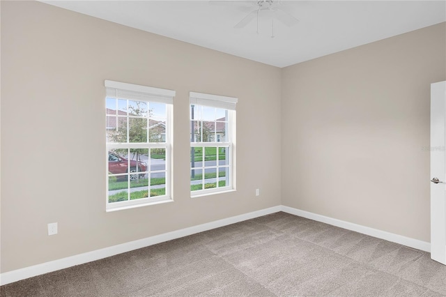 carpeted empty room with ceiling fan