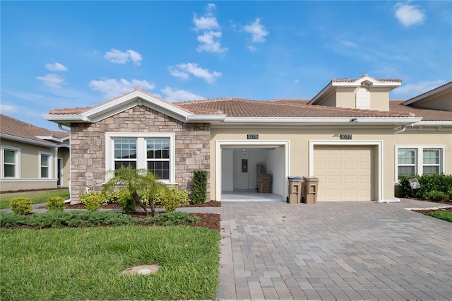 view of front of property with a garage