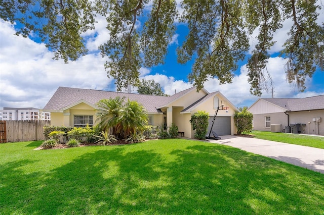 single story home with a front yard, central AC, and a garage