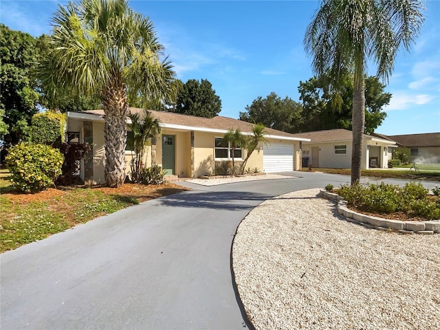 ranch-style house featuring a garage