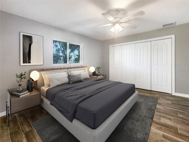 bedroom featuring ceiling fan, a closet, and dark hardwood / wood-style floors