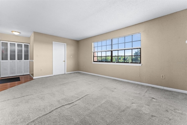 unfurnished room with carpet floors