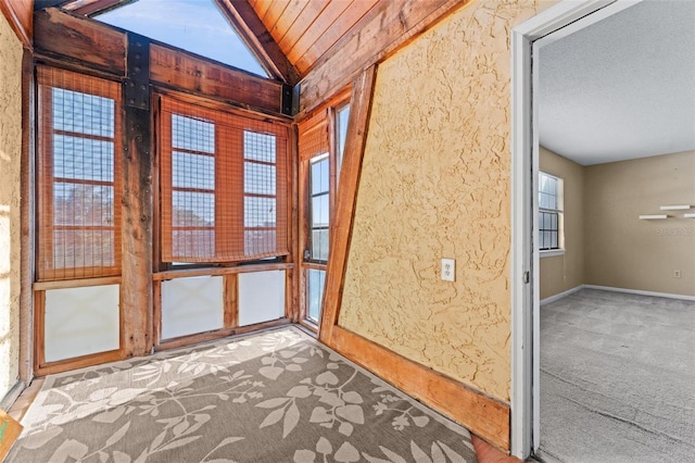 unfurnished sunroom with vaulted ceiling