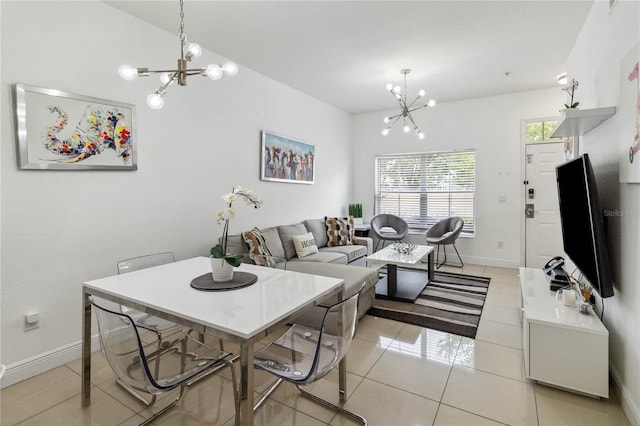 tiled dining space featuring a chandelier