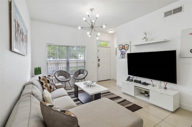 tiled living room with a chandelier