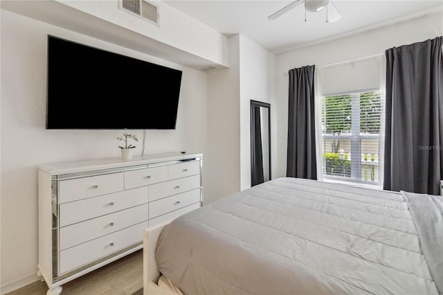 bedroom with ceiling fan and light hardwood / wood-style floors