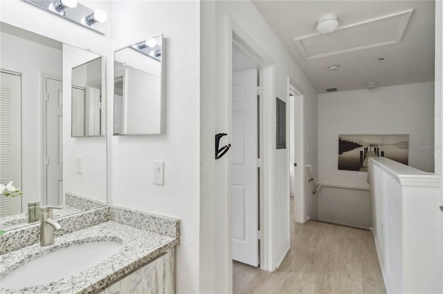 bathroom featuring vanity and hardwood / wood-style floors