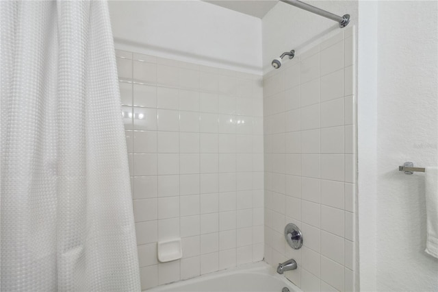 bathroom featuring shower / bath combo with shower curtain