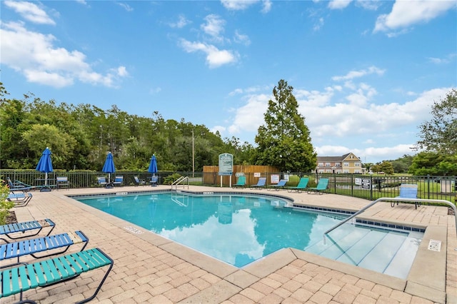 view of swimming pool featuring a patio area