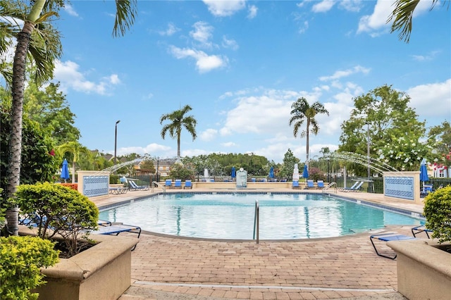 view of swimming pool with a patio