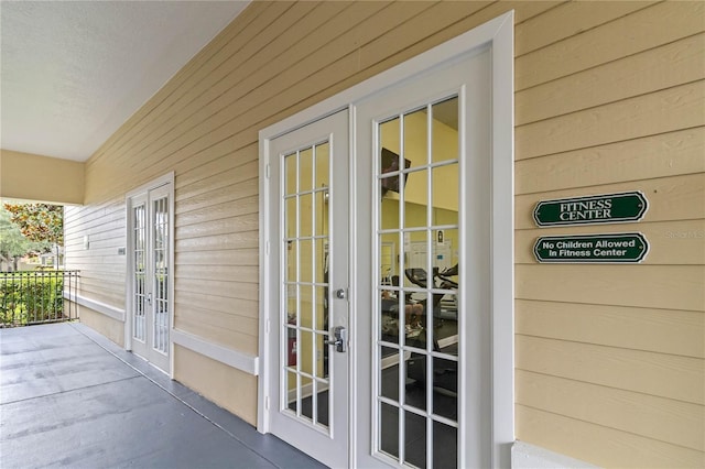 entrance to property featuring french doors