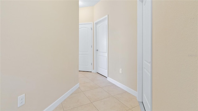 hallway with light tile patterned flooring