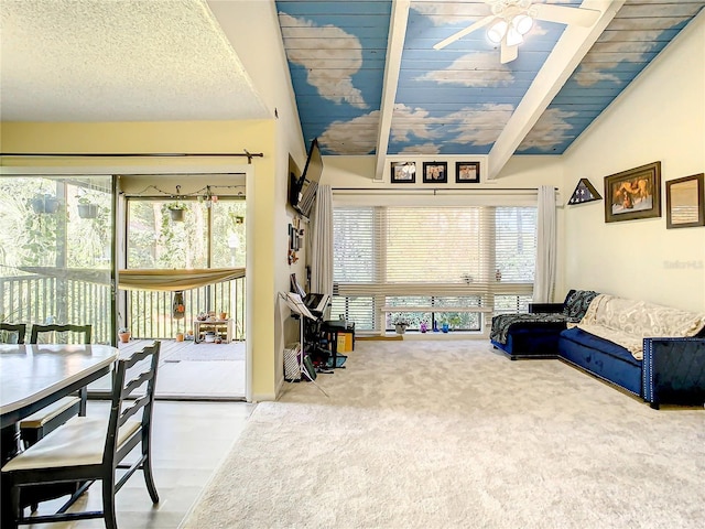 living room with ceiling fan, vaulted ceiling with beams, a textured ceiling, carpet, and wood ceiling