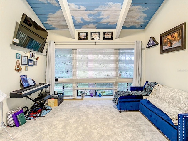 sitting room with carpet flooring, lofted ceiling with beams, and wooden ceiling