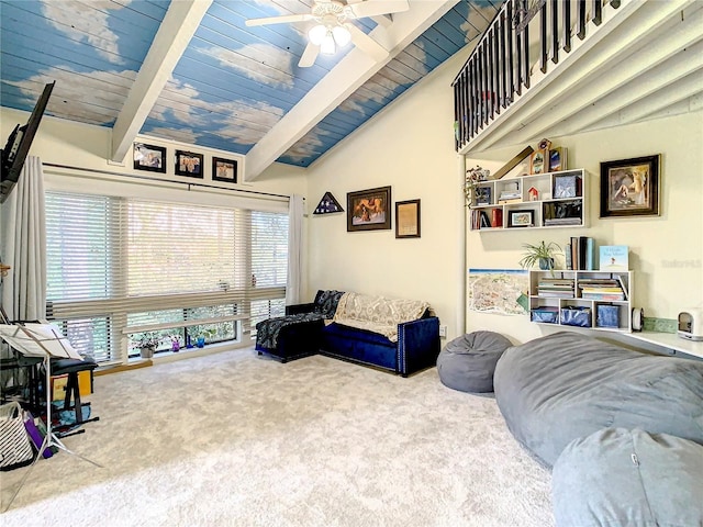 interior space with vaulted ceiling with beams, ceiling fan, carpet floors, and wood ceiling