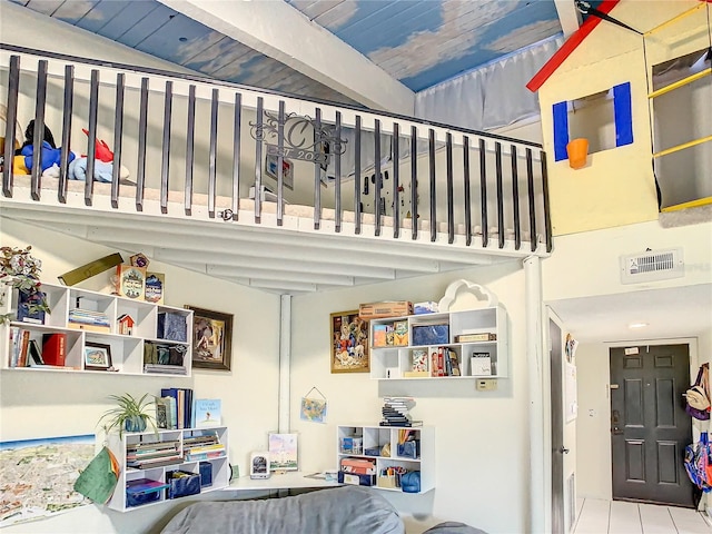 stairs featuring tile patterned floors, lofted ceiling with beams, and wood ceiling