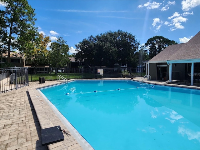 view of pool featuring a patio