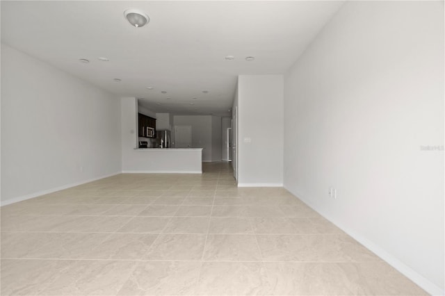 empty room with light tile patterned floors