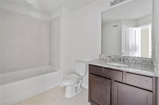 full bathroom featuring toilet, vanity, tile patterned floors, and tiled shower / bath combo