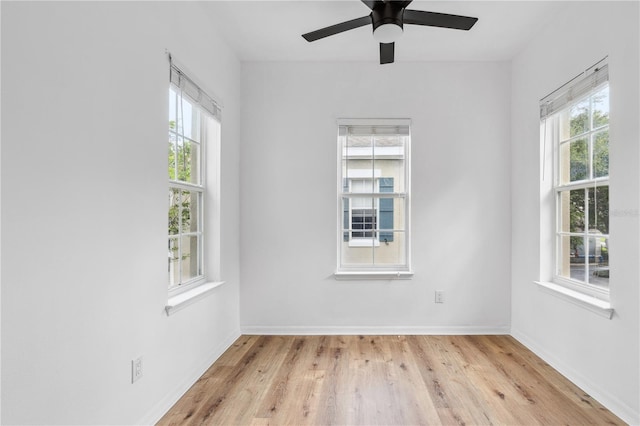 unfurnished room featuring ceiling fan and light wood-type flooring